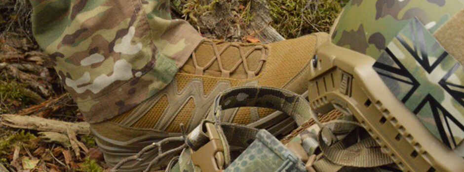 close up of LOWA Military Boot being worn outdoors next to military kit close up of LOWA Military Boot being worn outdoors next to military kit